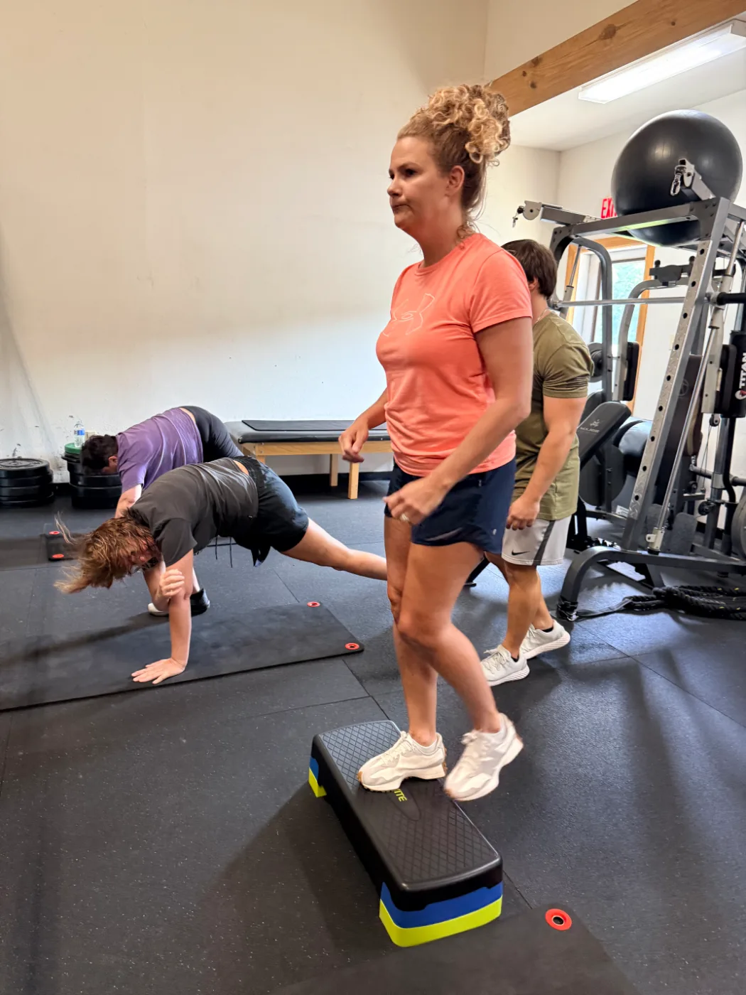 Coach leading a small-group training session at Paradigm Fitness