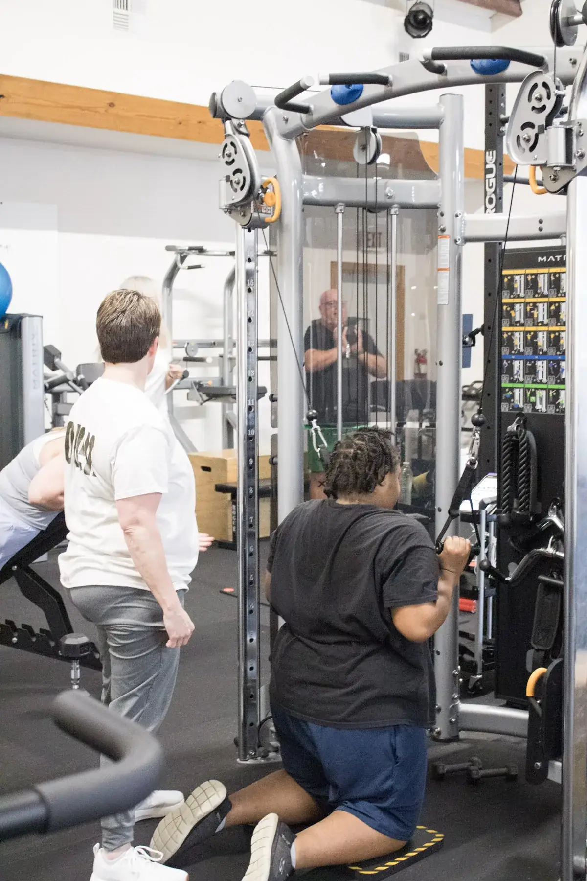 A Paradigm Fitness coach guiding a client through a training session